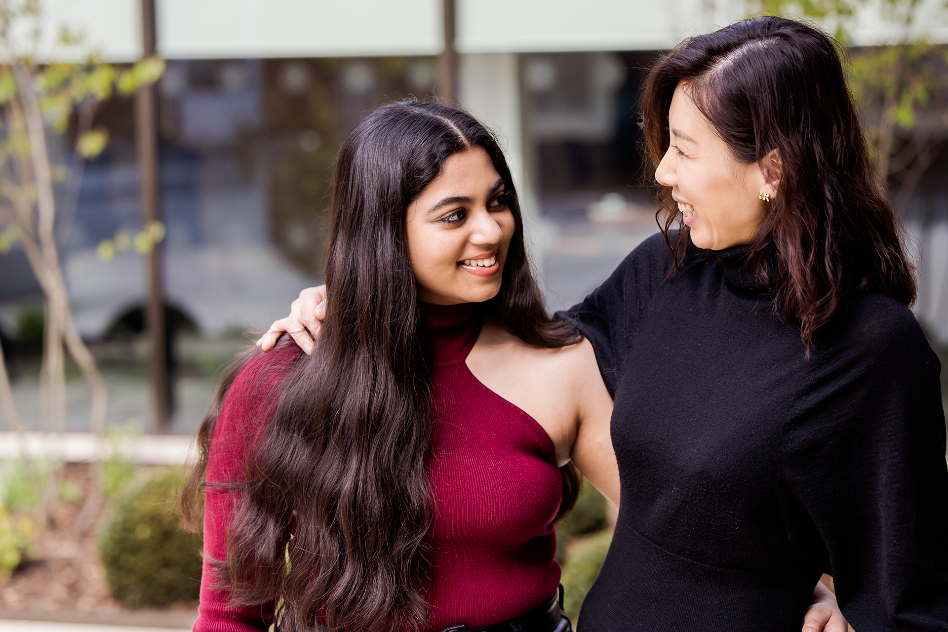 Mum and daughter laughing together