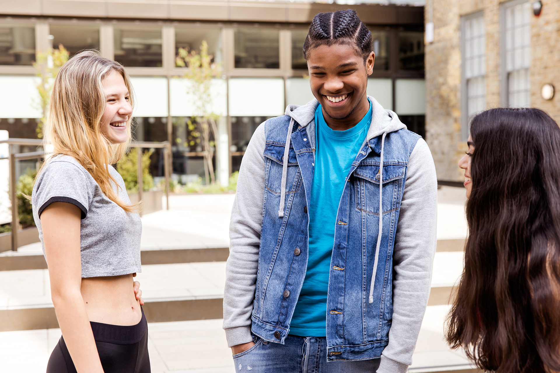 Teenagers chatting and laughing together